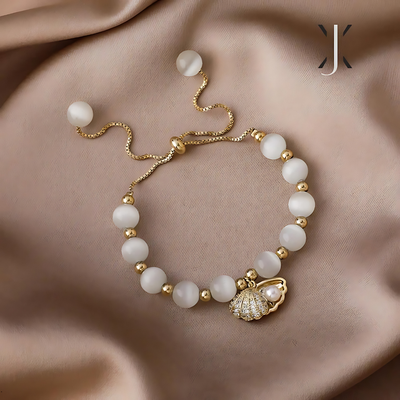 Pulsera de cuentas de ópalo y conchas marinas