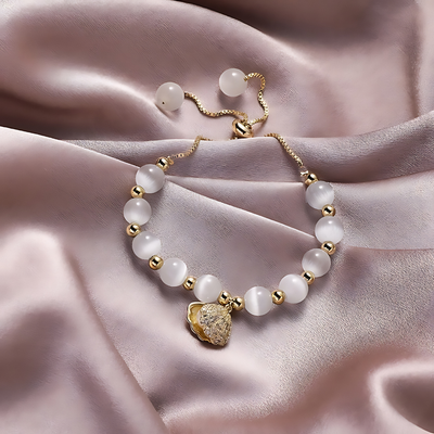 Pulsera de cuentas de ópalo y conchas marinas